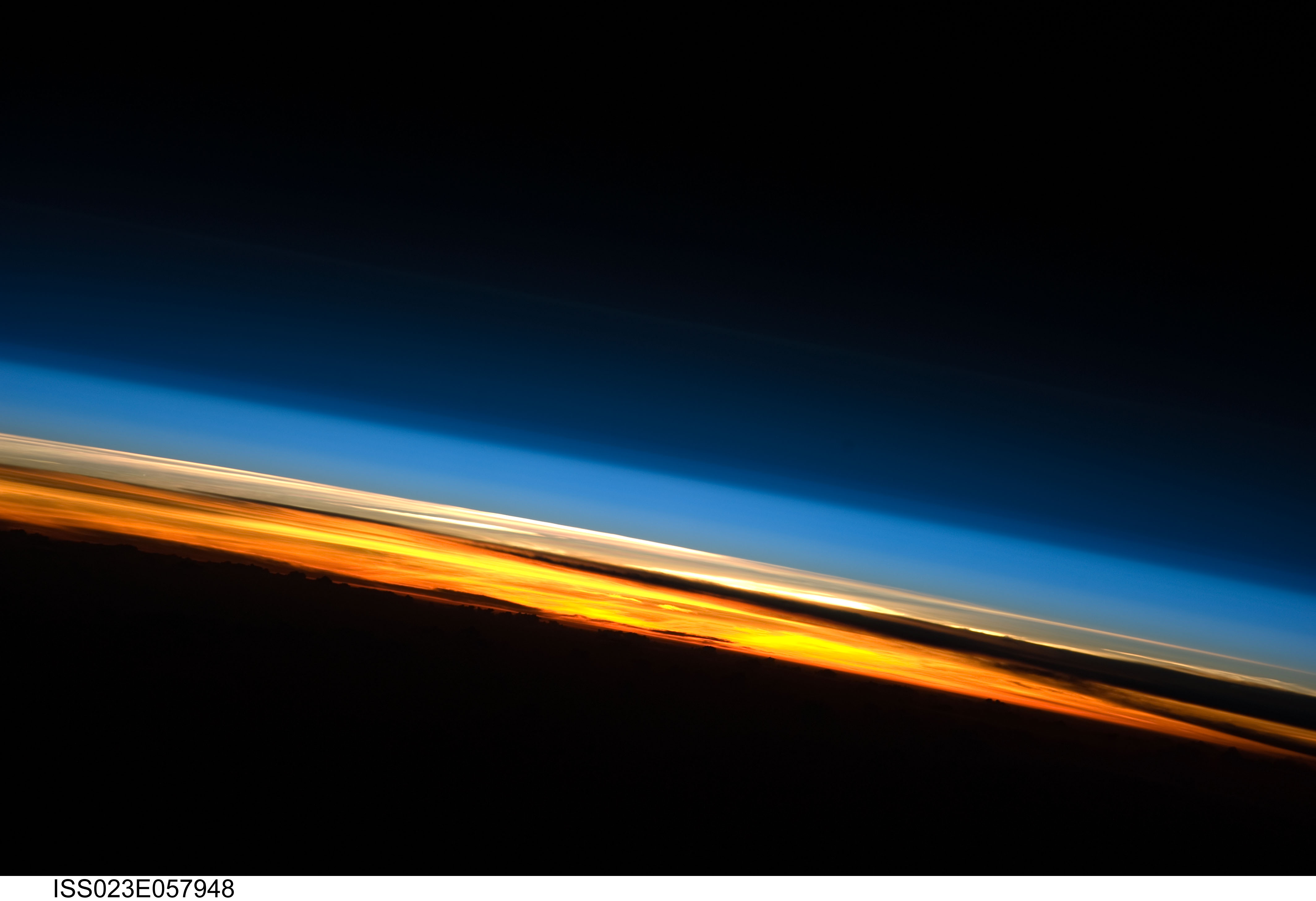 Sunset illuminates the thin layers of Earth’s atmosphere above the Indian Ocean.